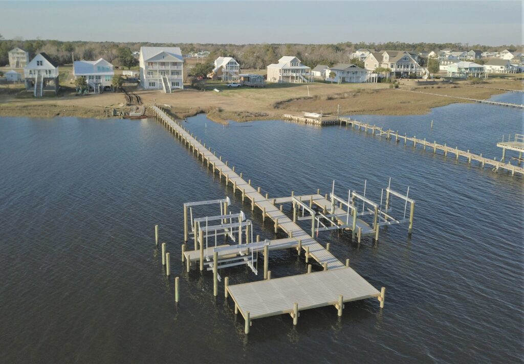 concrete dock with multiple boat lifts, Bobby Cahoon Marine Construction