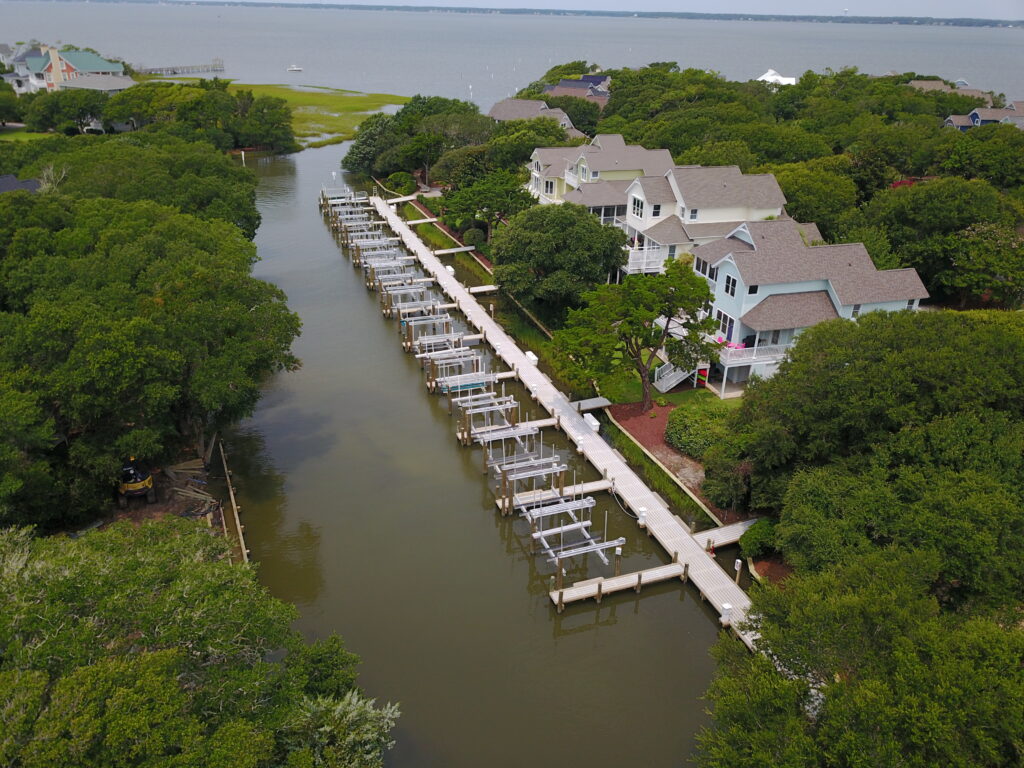drone view of large dock with multiple boat lifts, Bobby Cahoon Marine Construction