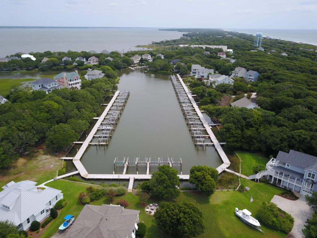 drone view of large dock with multiple boat lifts, Bobby Cahoon Marine Construction