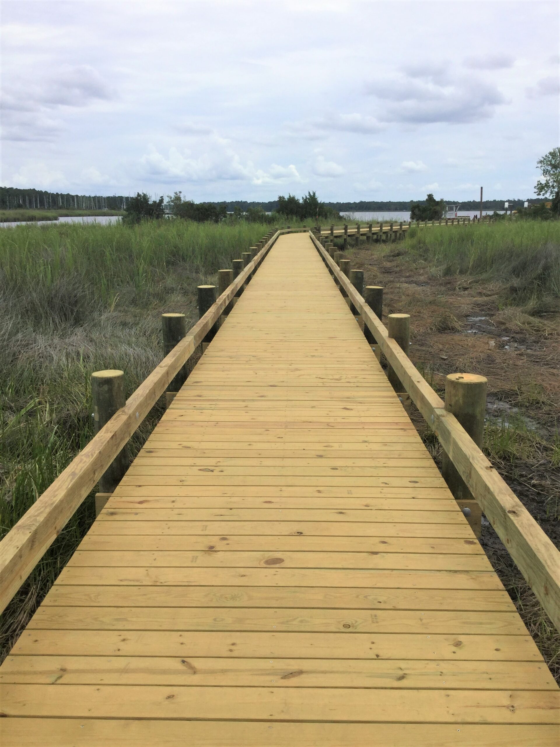 Wooden walkway over coastal marshlands. Bobby Cahoon Marine Construction