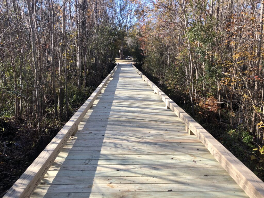 wooden walkway through the woods. Bobby Cahoon Marine Construction