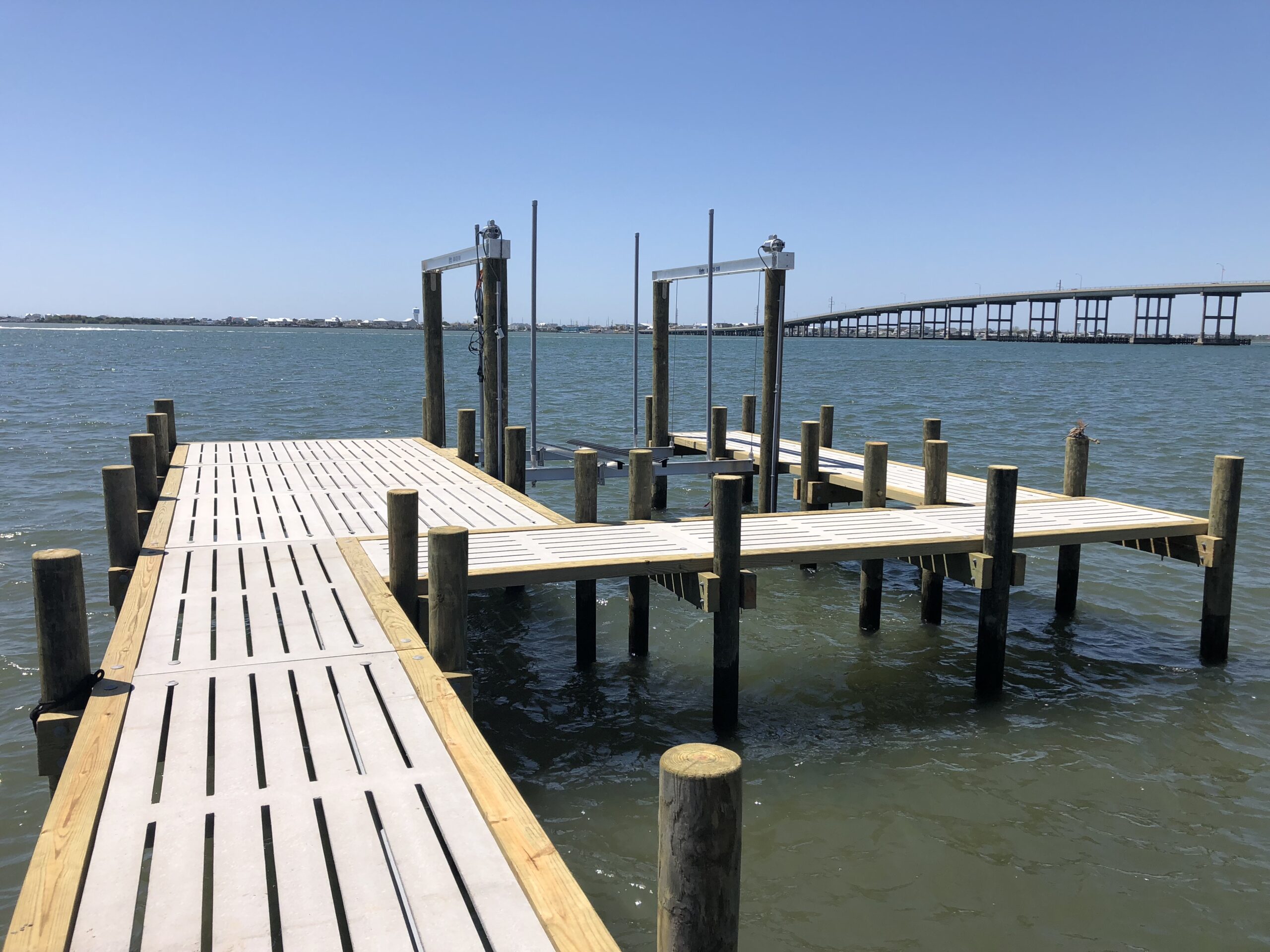 Concrete dock with boat lift in Morehead City, Eastern North Carolina, built by Bobby Cahoon Marine Construction, the best marine contractor in Eastern North Carolina